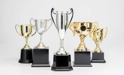 Gold and silver cup trophies on black bases